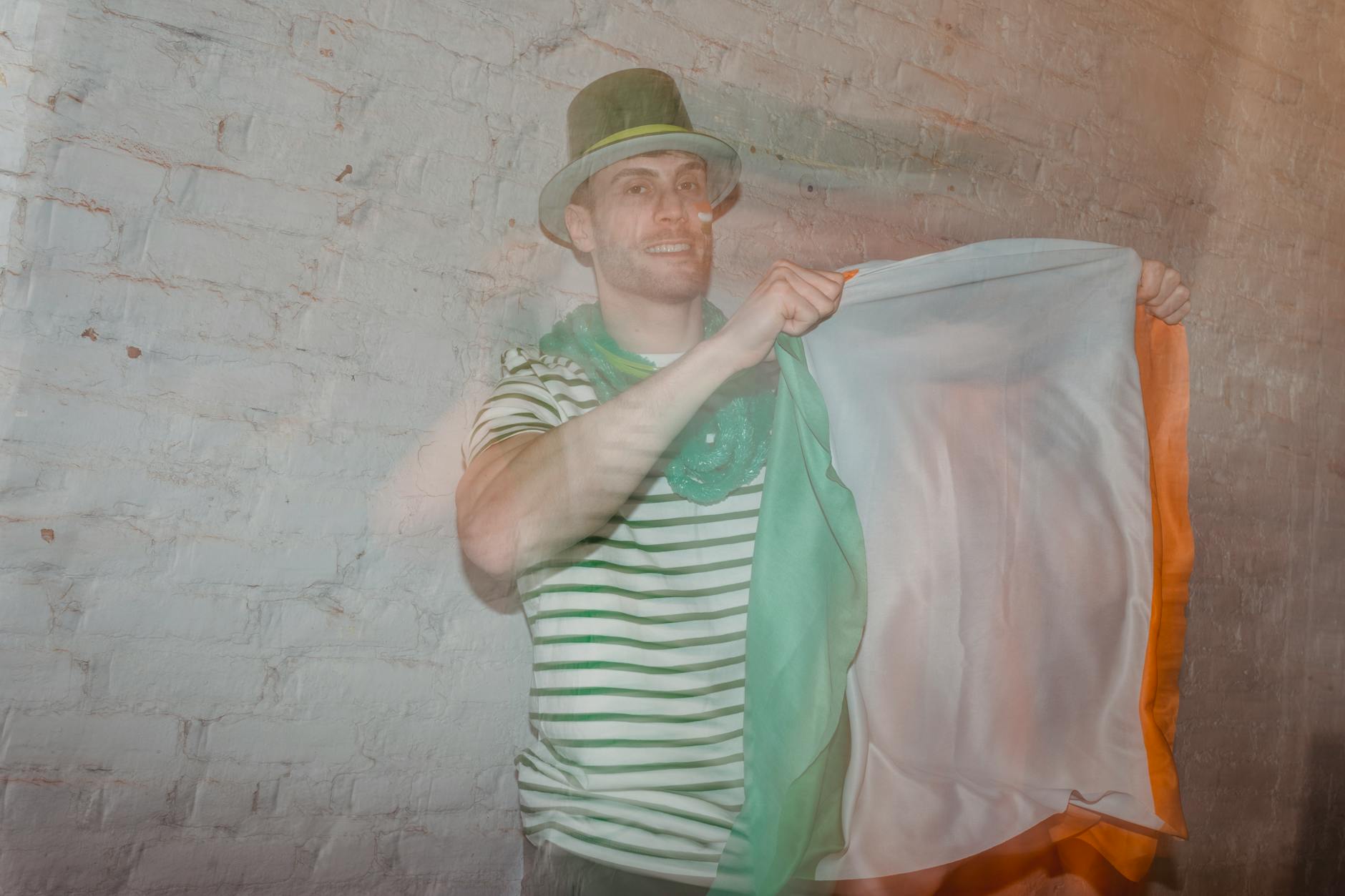 man with flag of ireland on st patricks day